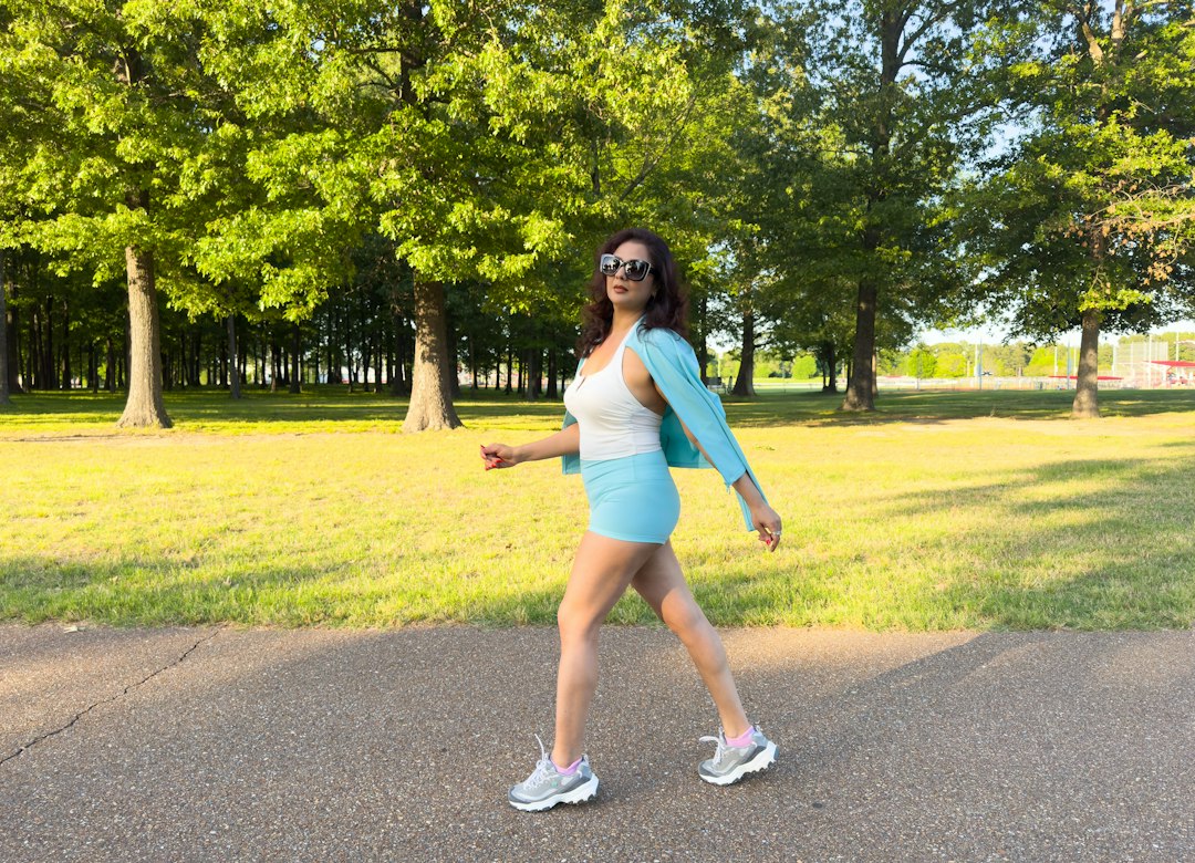 Woman jogging in a park as part of a Liraglutide weight loss program
