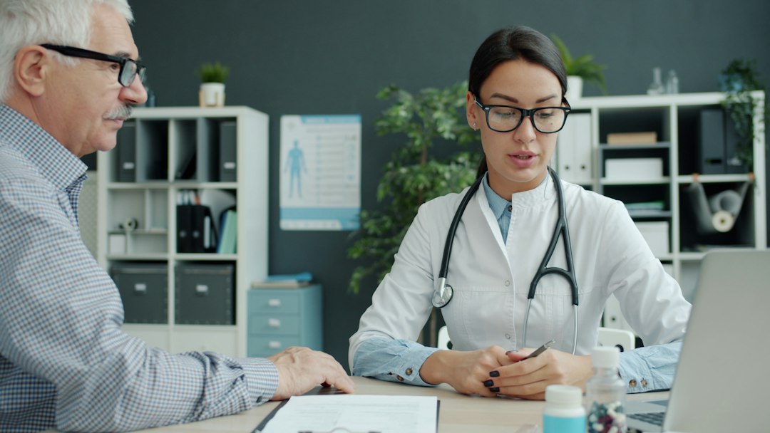 Doctor discussing Naltrexone and Bupropion treatment with a patient
