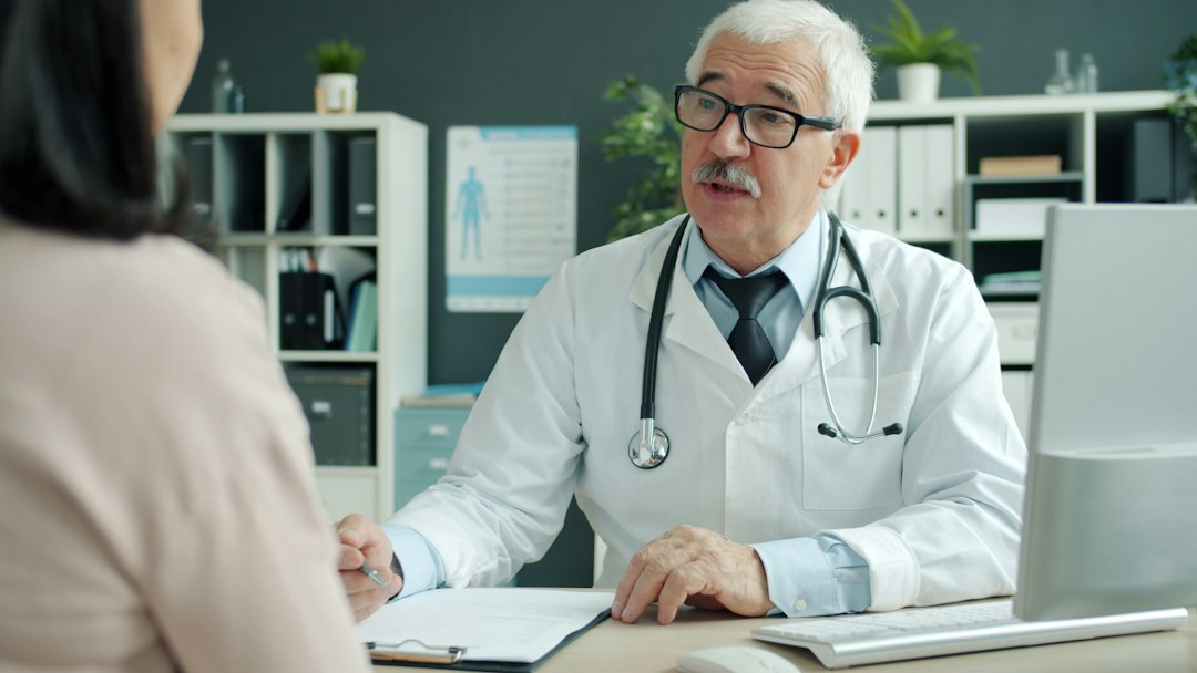 Physician discussing Metformin treatment with a patient