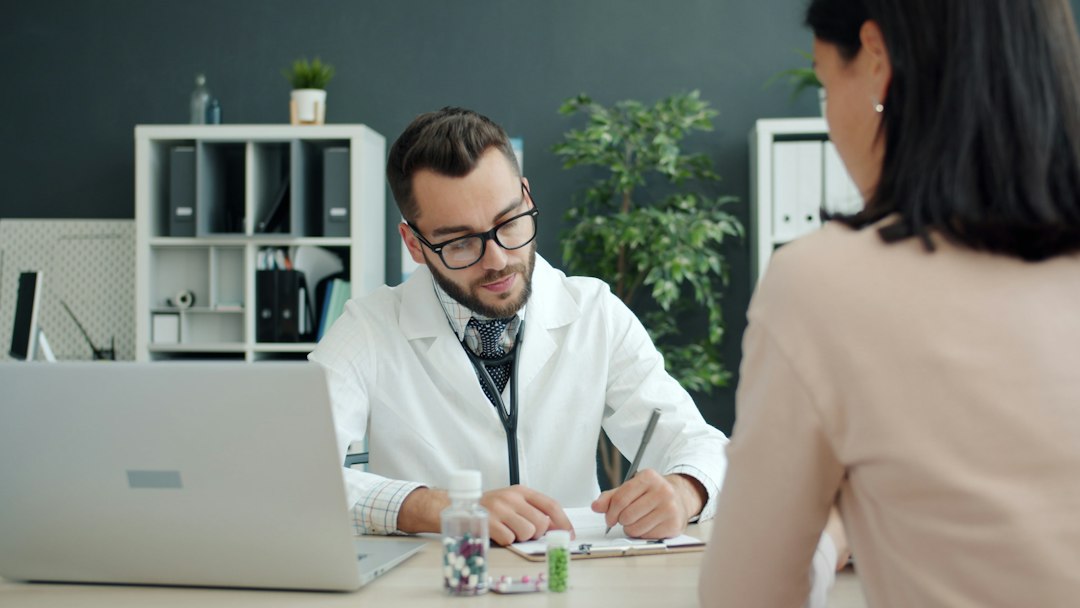 Doctor consulting a patient and recording health history for Phendimetrazine treatment