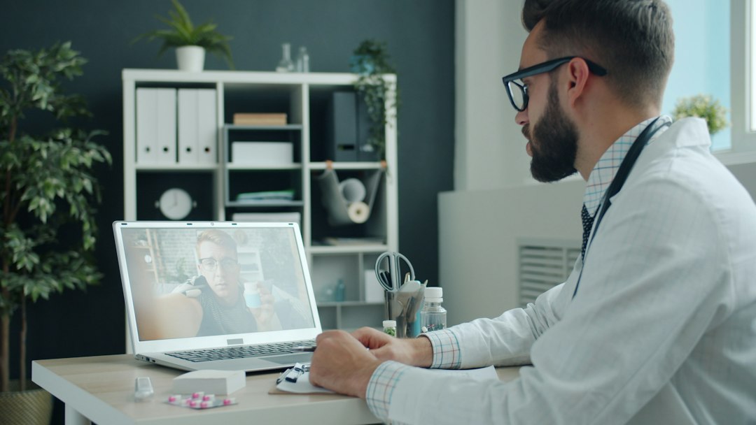 Doctor providing an online Semifluid telehealth consultation via laptop
